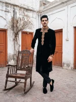 Men's royal black sherwani crafted from premium tropical fabric, featuring intricate handmade golden embroidery on the collar, front, and cuffs, perfect for weddings, grooms, and formal occasions.